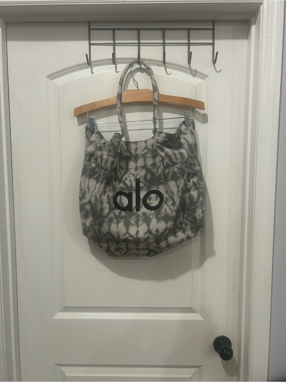 ALO Yoga Gray Tie-Dye Canvas Tote. It does have a small hole on the front